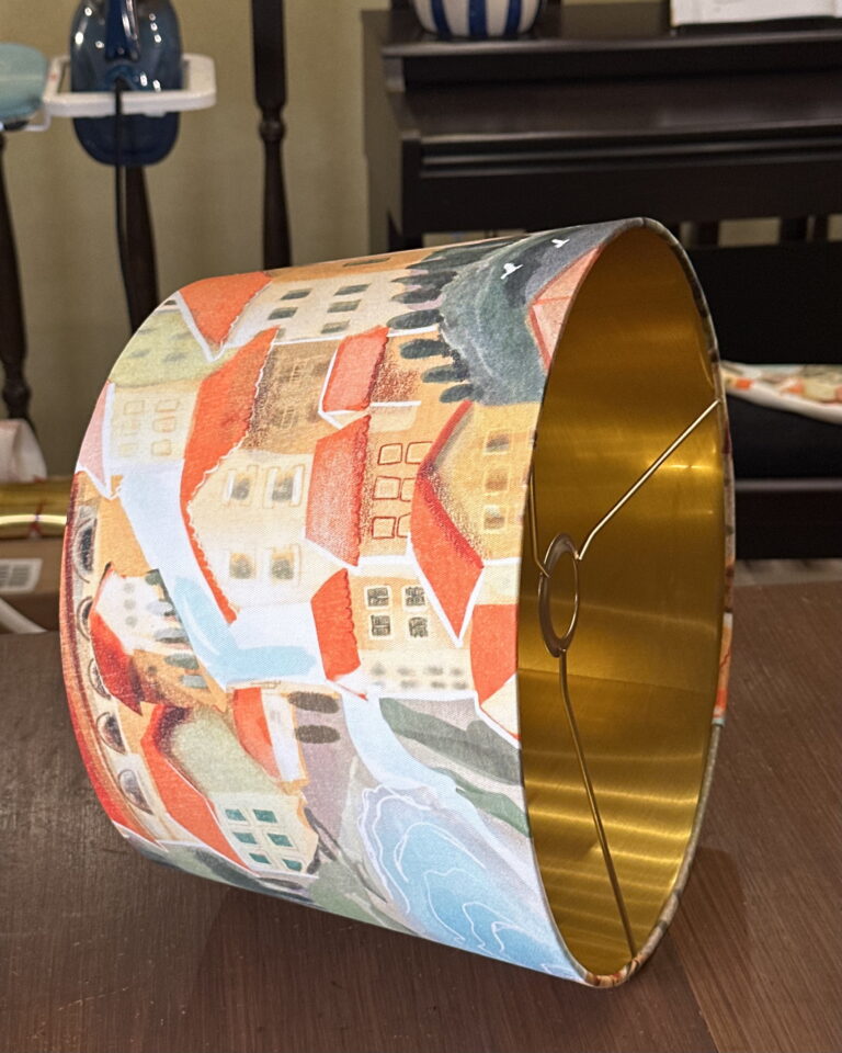 Side view of handmade Italian Villa on Sunset empire lampshade with brushed gold interior.