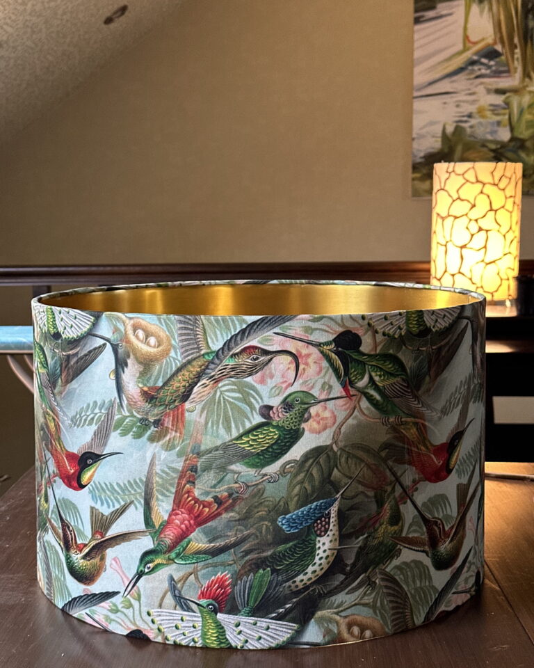 Brushed gold interior of Hummingbird Paradise lampshade reflecting warm light — luxury handmade lampshade.